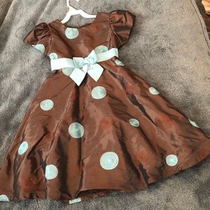 A kids short sleeved polka dot dress